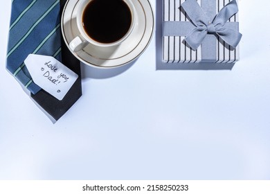 Father Day Greeting Card Background. Fathers Day Concept With Gift Box, Tools And Ties, Coffee Cup, Gift Tag  Love You Dad, On White Background Top View Copy Space