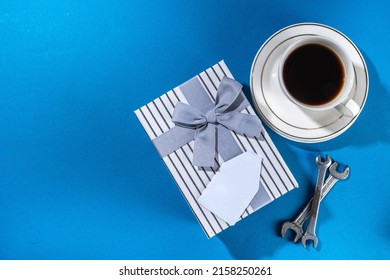 Father Day Greeting Card Background. Fathers Day Concept With Gift Box, Tools And Ties, Coffee Cup, Gift Tag  Love You Dad, On Brightblue Background Top View Copy Space