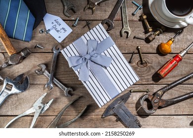 Father Day Greeting Card Background. Fathers Day Concept With Gift Box, Tools And Ties, Coffee Cup, Gift Tag  Love You Dad, On Rustic Wooden Background Top View Copy Space