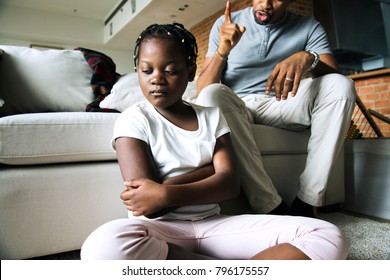 Father disciplining his daughter - Shutterstock ID 796175557