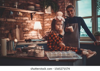 Father With Dracula Makeup And His Little Daughter In Hat Are Ready For Halloween Party.