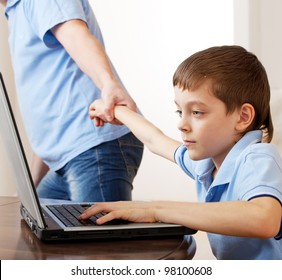 Father Dragging Son From The Computer. Parent Pulling Child From Laptop. Computer Addiction