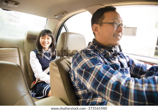 father driving to\
school with teen\
daughter