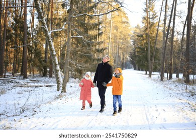 A father enjoys a leisurely walk with his two children through a beautiful snowy forest. The scene captures the joy of family time amidst the serene winter landscape, with snow-covered trees creating - Powered by Shutterstock