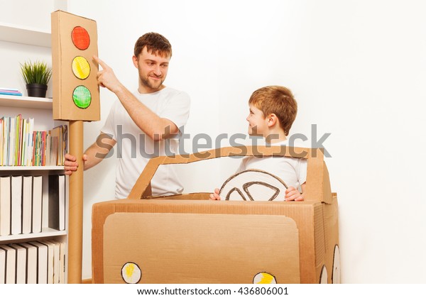 Father\
explaining traffic regulations to his\
kid
