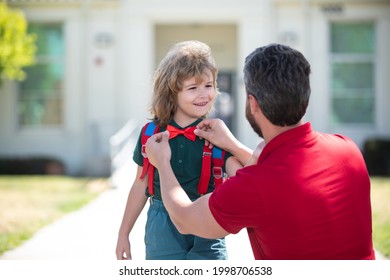 Father Getting Son Wearing School Uniform Ready For First Day Of School. Funny Nerd. School Boy Going To School With Father.