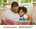 Father, girl child and reading book in home for family bonding, learning and development in lounge. Dad, kid and together on sofa for storytelling with fairytale, parent teaching for childhood growth