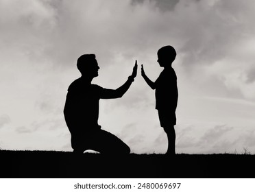 Father giving son high five. Parent child relationship concept - Powered by Shutterstock