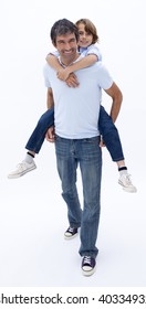 Father Giving Son Piggy Back Ride Against White Background