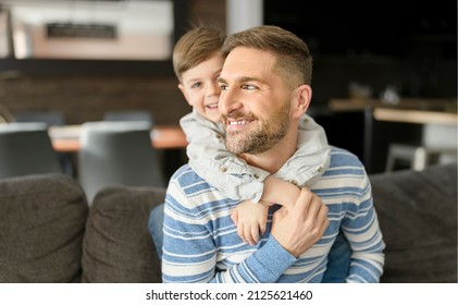 A Father Or Godfather Having Fun On The Living Room At Home