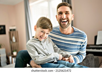 A Father Or Godfather Having Fun On The Living Room At Home