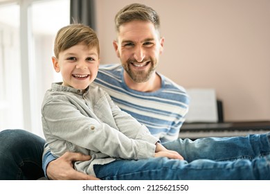 A Father Or Godfather Having Fun On The Living Room At Home