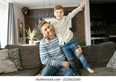 A Father Or Godfather Having Fun On The Living Room At Home Hand High