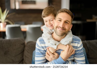 A Father Or Godfather Having Fun On The Living Room At Home