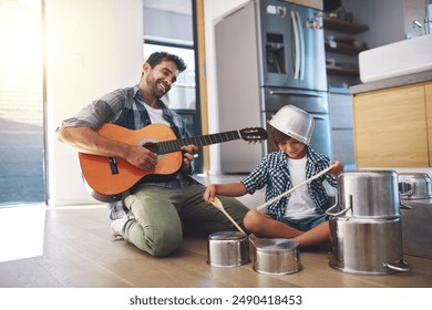 Father, guitar and kid in kitchen with music learning, drums and fun with musician game for creativity development. Drummer, instrument and young boy with love, care and support from parent playing - Powered by Shutterstock