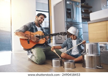 Father, guitar and kid in kitchen with music learning, drums and fun with musician game for creativity development. Drummer, instrument and young boy with love, care and support from parent playing