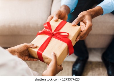 Father Hands Giving Birthday Gift To Daughter, Closeup