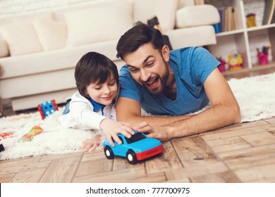 Father has fun with his son. An exemplary father and a boy at leisure. Father plays games with boy. Father and son concept. - Powered by Shutterstock