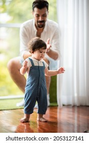 Father Help Children Baby To Walk, Childhood Family People With Little Cute Toddler Child Son, Happy Learning In First Step With Support Together From Father At Home