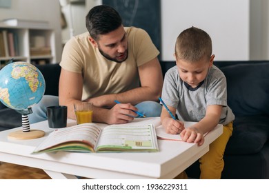 father helping his son to do homework - Powered by Shutterstock