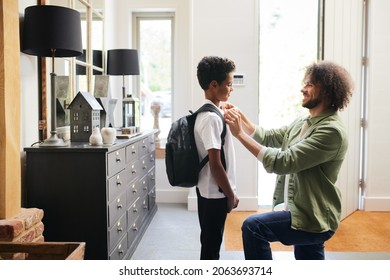 Father helping son get ready for school - Powered by Shutterstock