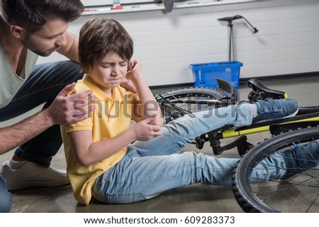 How To Catch Falling Son >> Father Helping Wounded Son Getting Falling Stock Photo Edit Now How To Catch Falling Son >> Father Helping Wounded Son Getting Falling Stock Photo Edit Now