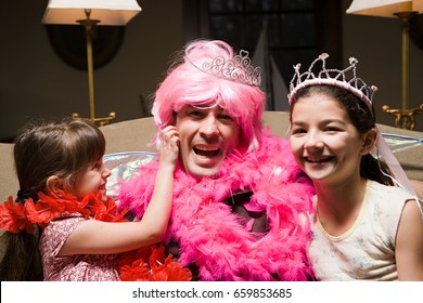 A Father And His Daughters Playing Fancy Dress