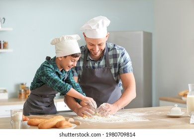 Father and his little son cooking in kitchen - Powered by Shutterstock