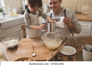 A father and his son cooking