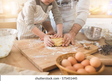 A father and his son cooking