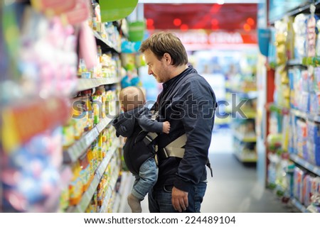 Father and his son at supermarket