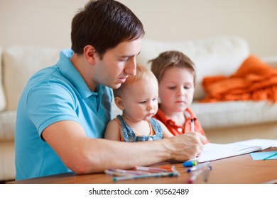 Father   his two kids drawing together