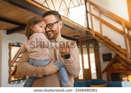 Similar – Image, Stock Photo young man holding his fiance’s hand with gold ring while making a marriage proposal with bouquet of red roses. Engagement of a young couple in love. The concept of love and togetherness.