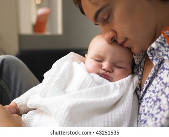 Father Holding Baby. Both Are Sleeping. Horizontally Framed Shot.