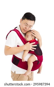 Father  Holding A Baby In A Baby Carrier