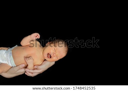 Baby girl with pompom hat sleeping