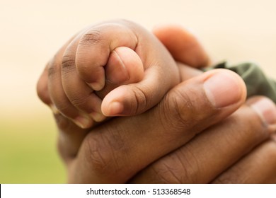 Father Holding His Daughter's Hand.