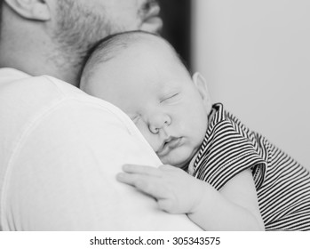 Father Holding His Newborn Baby, Black And White