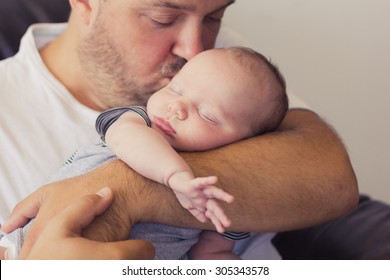 Father Holding His Newborn Baby.