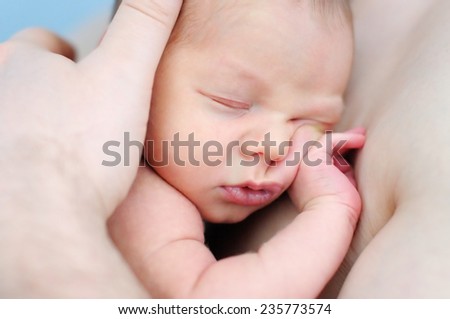 Similar – Newborn lying on the bed with her mother