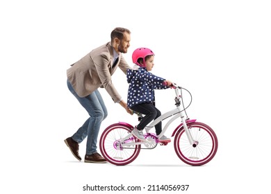 Father holding a little girl trying to ride a bicycle isolated on white background - Powered by Shutterstock