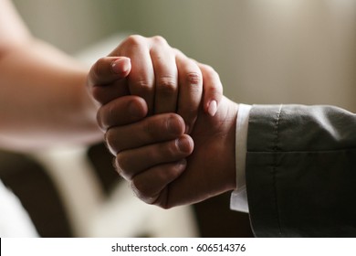 Father Holds His Daughter By The Hand At The Wedding