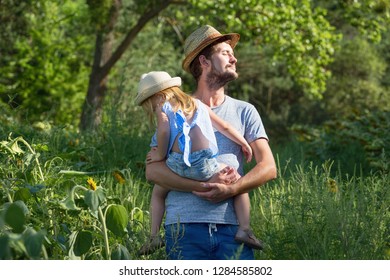 Father holds his daughter on the hands. Trip to the countryside - Shutterstock ID 1284585802
