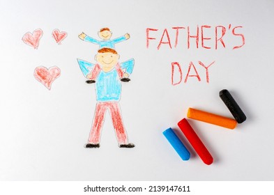 The father holds his son his shoulders  Children's drawing and crayons  The inscription father's Day 