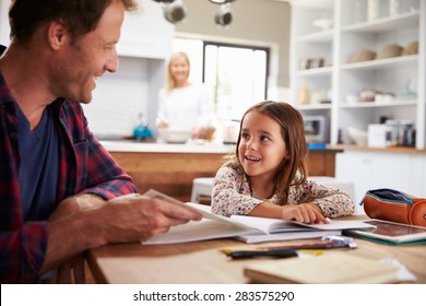 Father Home Schooling His Young Daughter