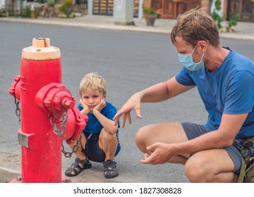 Father Influence Son Worldview Family Education Study Everyday Knowledge Skills. Dad In Blue COVID Face Mask Show Tell Teach Child Fireman Fighters Engine Use Red Fire Hydrant. Children Safety Concept