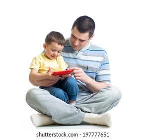 father and kid are looking to play and read tablet computer