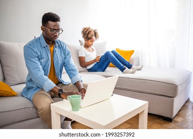 Father With Kid Trying To Work From Home During Quarantine. Stay At Home, Work From Home Concept During Coronavirus Pandemic. Father And School-girl Working Form Home, Telework And E-learning