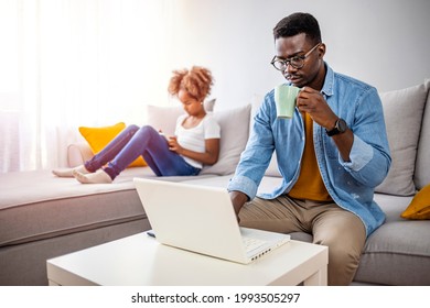 Father With Kid Trying To Work From Home During Quarantine. Stay At Home, Work From Home Concept During Coronavirus Pandemic. Father And School-girl Working Form Home, Telework And E-learning