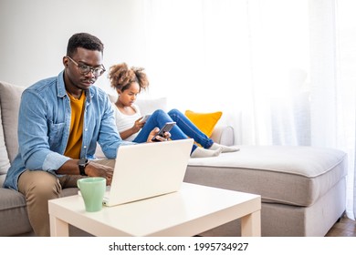 Father With Kid Trying To Work From Home During Quarantine. Stay At Home, Work From Home Concept During Coronavirus Pandemic. Father And School-girl Working Form Home, Telework And E-learning